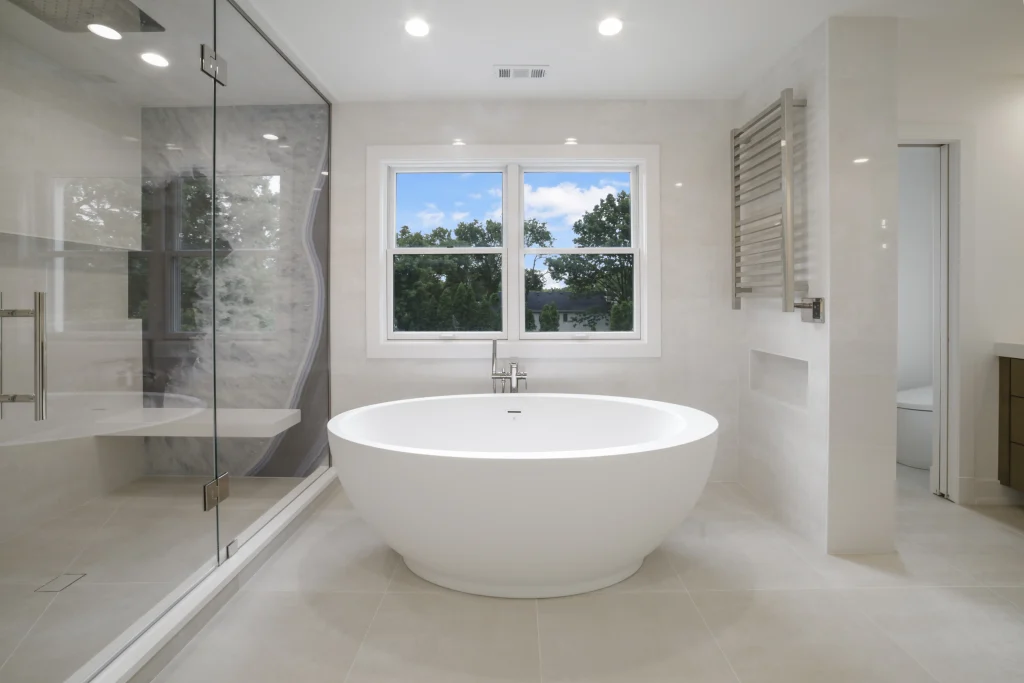 Spacious modern bathroom with a large white freestanding tub
